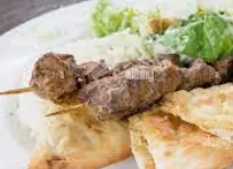 Lamb kebab with garlic naan & salad