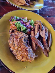 Flame Grilled Periperi chicken with chips & Salad